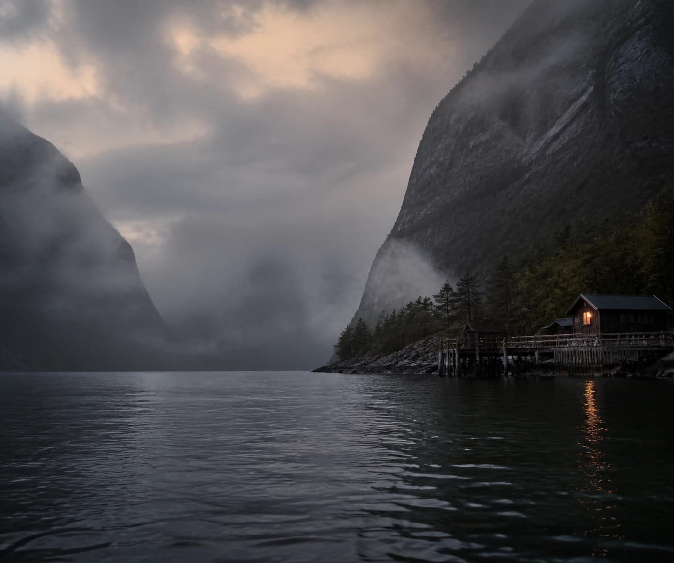 Illustrative Norwegian fjord in mist, with a waterside cabin